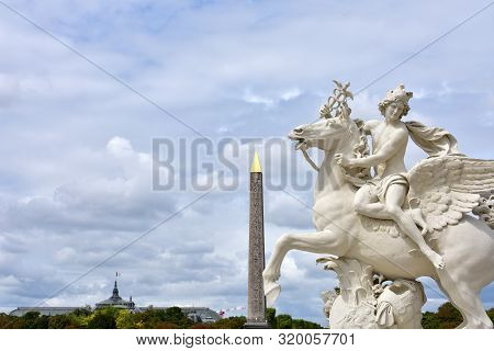 View From Tuileries Garden With Luxor Obelisk, Grand Palais And Statue, Copy Of Mercure Riding Pegas