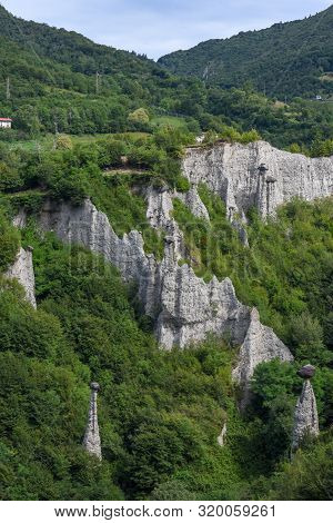 Monument Rocks (chalk Pyramids) Of Zone At Lake Iseo In Italy