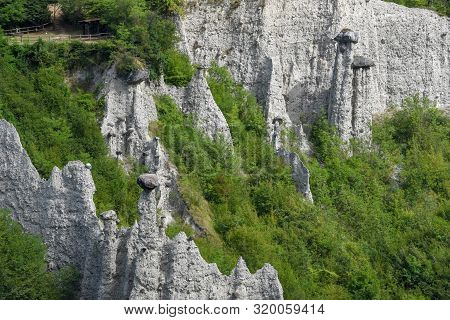 Monument Rocks (chalk Pyramids) Of Zone At Lake Iseo In Italy