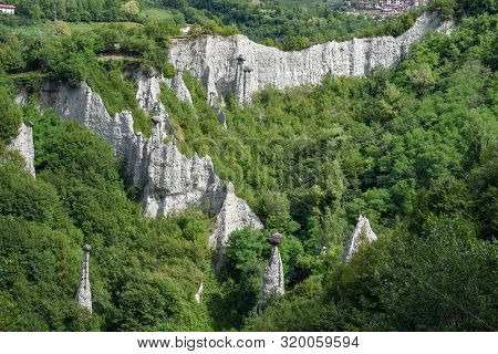 Monument Rocks (chalk Pyramids) Of Zone At Lake Iseo In Italy