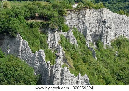 Monument Rocks (chalk Pyramids) Of Zone At Lake Iseo In Italy
