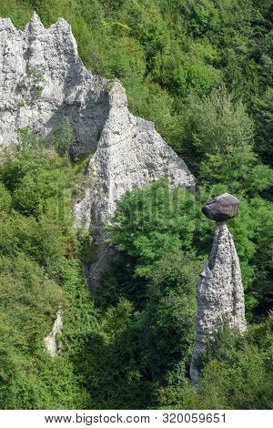 Monument Rocks (chalk Pyramids) Of Zone At Lake Iseo In Italy