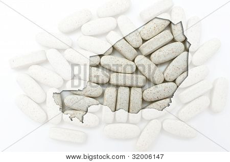 Kontur kort i Niger med piller i baggrunden For sundhed og helbredelse