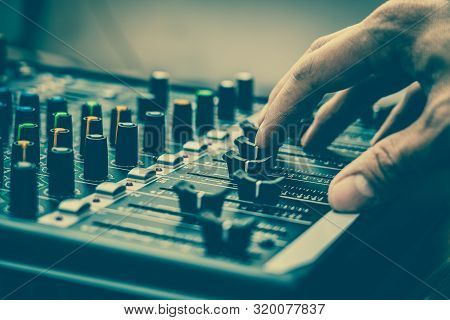 Closeup Hand Adjust The Audio Mixer, Music Equipment Concept