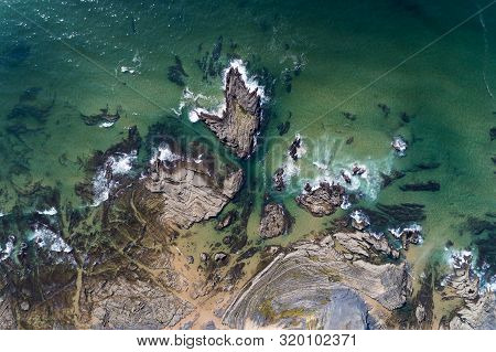 Aerial View Of The Rock Formations At The Carreagem Beach In Aljezur, Algarve;