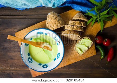 Butter With Cannabis Plant In A Bowl Top View