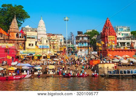 Varanasi, India - April 12, 2012: Colorful Boats And Ganges River Bank In Varanasi City In India