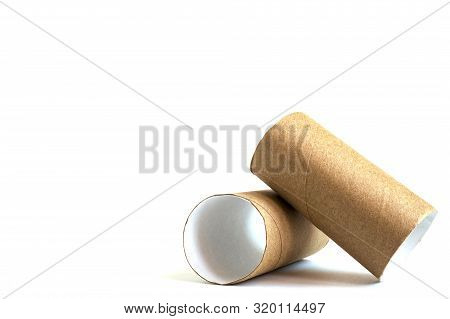 Composition From Two Cardboard Paper Tubes On White Background. Close-up Of Empty Toilet Rolls, Copy