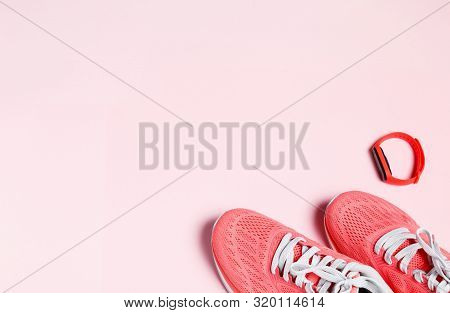 Fittnes Sport Composition With Pink Sneakers, Smart Bracelet On Pink Background.