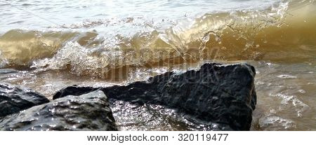 Background Of Sea Stones And The Sea Serf For Design.sea Surf, The Wave Hits The Rocks. Coastline Fo