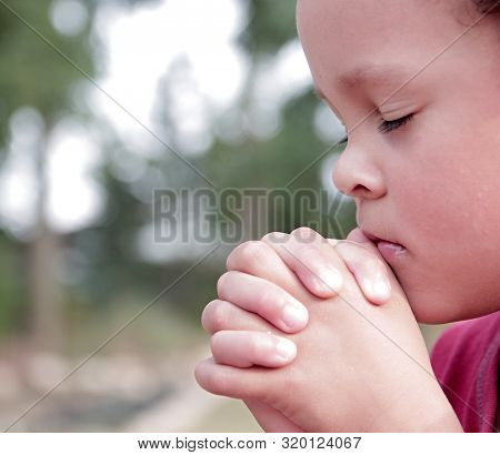 Boy Praying To God Stock Image With Hands Held Together With Closed Eyes Stock Photo