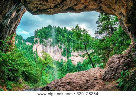 Beautiful Scenic Summer Landscape Of Kurdzhips Gorge Viewed From Inside Rocky Grotto With Waterfall 