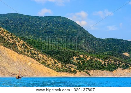 Black Sea Coastline With Caucasus Mountains Viewed From The Sea. Scenic Coastal Landscape At Sunny D