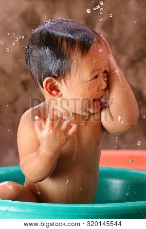 Cute Little Baby Enjoying His Morning Bath