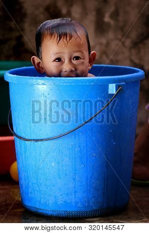 Cute Little Baby Enjoying His Morning Bath