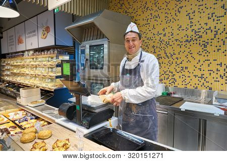 VERONA, ITALY - CIRCA MAY, 2019: indoor portrait of a worker at Pam supermarket in Verona. 