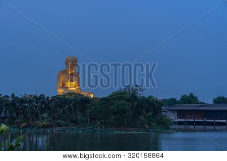 sunrise at the big Buddhist Monks Luang Phor Tuad Statue At Buddha Uttayarn Maharach Project Ayuttha