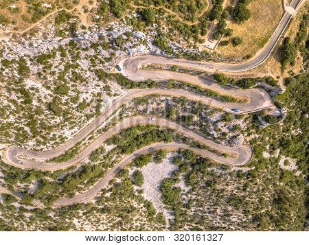 Aerial Top Down View Of Hairbpin Bend Road In Cevennes, Occitania, France