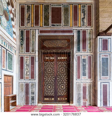 Cairo, Egypt- January 16 2016: Old Colorful Marble Wall With Wooden Door Decorated With Arabesque Or