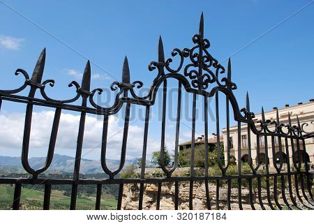 Ornate Iron Fence Panel On The New Bridge With Views Across The Spanish Countryside, Ronda, Malaga P