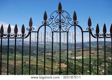 Ornate Iron Fence Panel On The New Bridge With Views Across The Spanish Countryside, Ronda, Malaga P