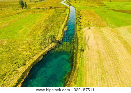 Beautiful Gacka River Flowing, Field Aerial Summer View, Lika Region Of Croatia