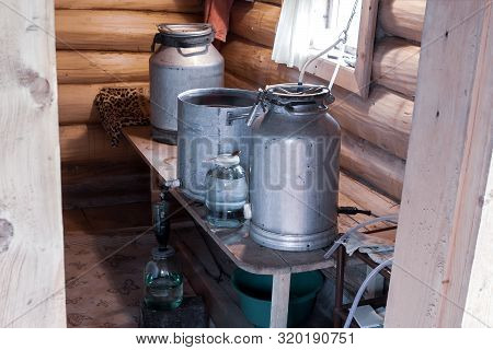 The Process Of Preparing Moonshine In A Village Bath In A Primitive Moonshine Distilling-apparatus.