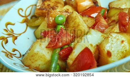 Punjabi  Shimla Mirch Aloo, Indian Dish Prepared With Potatoes And Green Pepper Cooked In A Tomato G