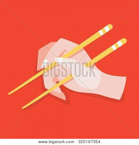 Hand Hold Chinese Or Japanese Chopsticks. Eating Asian Food