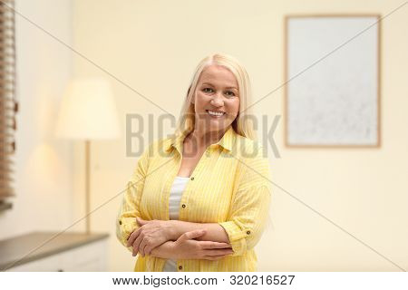 Portrait Of Happy Mature Woman At Home