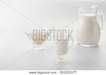 Homemade Non Diary Sesame Milk In The Glass Cup  Andin The Pitcher On Light  Background. Selective F
