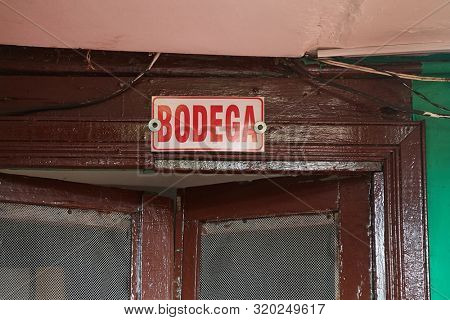 Sign Bodega over door, Spanish word meaning warehouse of strorage room