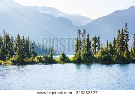 Hike to turquoise waters of picturesque Garibaldi Lake near Whistler, BC, Canada. Very popular hike destination in British Columbia.