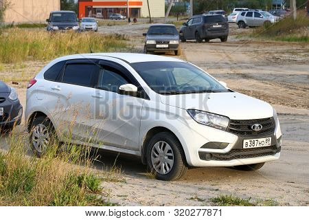 Novyy Urengoy, Russia - September 1, 2019: White Crossover Lada X-ray In The City Street.
