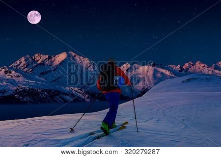 Night kiing with amazing view of swiss famous mountains in beautiful winter snow.