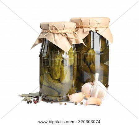 Jars With Pickled Cucumbers On White Background