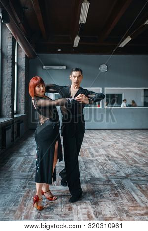 Elegance couple on ballrom dance training in class