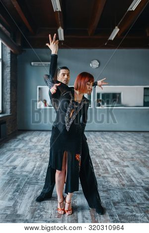Dancers in costumes on ballrom dance training
