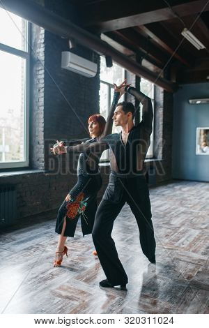 Elegance couple on ballrom dance training in class