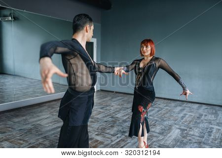 Dancers in costumes on ballrom dance training