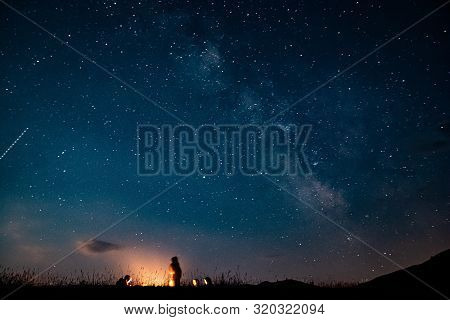 People By Fire Camp With Milky Way On The Sky Near Durmitor In Montenegro, Europe