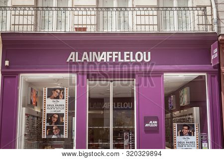 Lyon, France - July 18, 2019: Alain Afflelou Logo In Front Of Their Shop For Lyon. Alain Afflelou Is