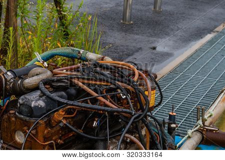 Taean, South Korea; August 14, 2019: Closeup Of Wires And Cables On Top Of Rusted Inboard Engine Exp