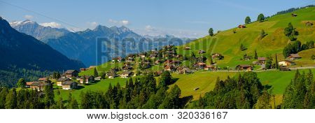 Summer time countryside panoramic landscape in Switzerland near Habkern village