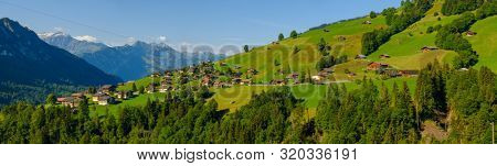 Summer time countryside panoramic landscape in Switzerland near Habkern village