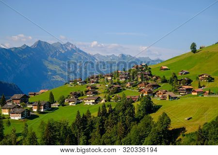 Summer time countryside panoramic landscape in Switzerland near Habkern village