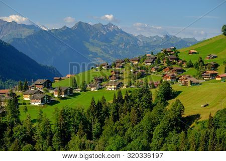 Summer time countryside panoramic landscape in Switzerland near Habkern village