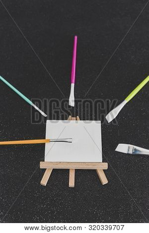 Mini Blank Canvas And Paintbrush With Copyspace