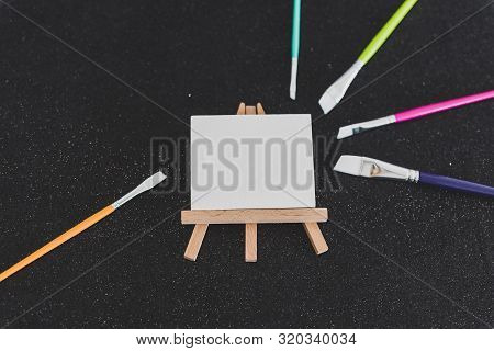 Mini Blank Canvas And Paintbrush With Copyspace