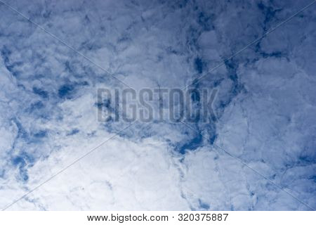 The Texture Of The Clouds. Abstract White, On A Blue Background.